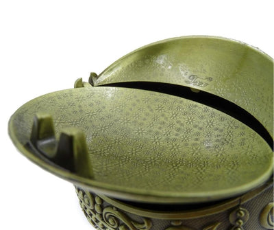 Elegante metalen asbak in bolvorm met gravure
