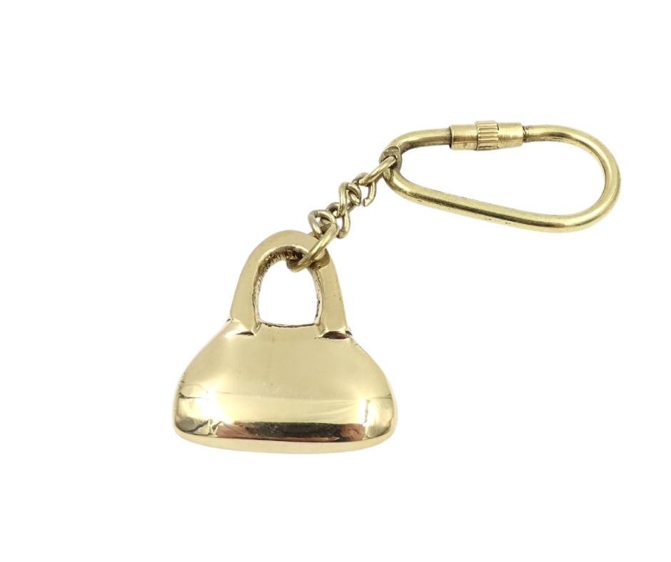 Messing sleutelhanger in de vorm van een handtas met personaliseerbare gravure